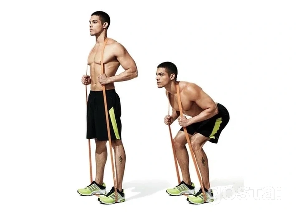 Ефективні вправи з фітнес резинками для тренування вдома та в залі: гіперекстензія стоячи