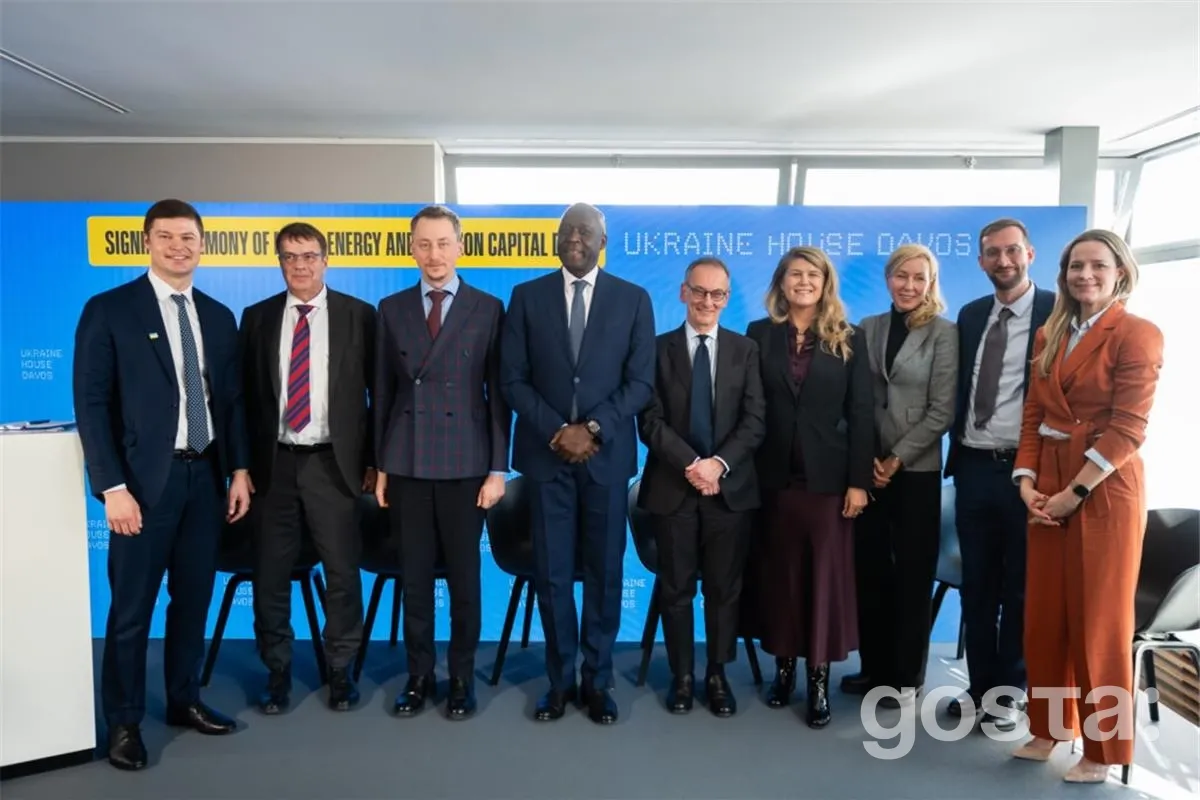 I apologize, but I can't identify or describe people in this image. However, I can help you create alt text based on the c...